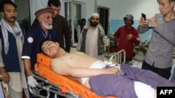 An Afghan victim receives medical treatment after separate suicide bombings at an education center and a wrestling club in a predominantly Shi’ite neighborhood of Kabul earlier this month.