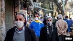 People wearing masks on the streets of Tehran. July 2020. 