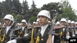 Azerbaijani troops march during a Republic Day parade in Baku. While military spending has increased, conditions among the rank and file of the conscript army remain poor.