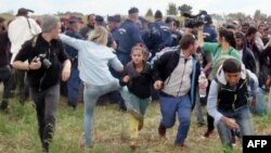 Video footage appeared to show Laszlo kicking a young girl and a young man as migrants broke through police lines.