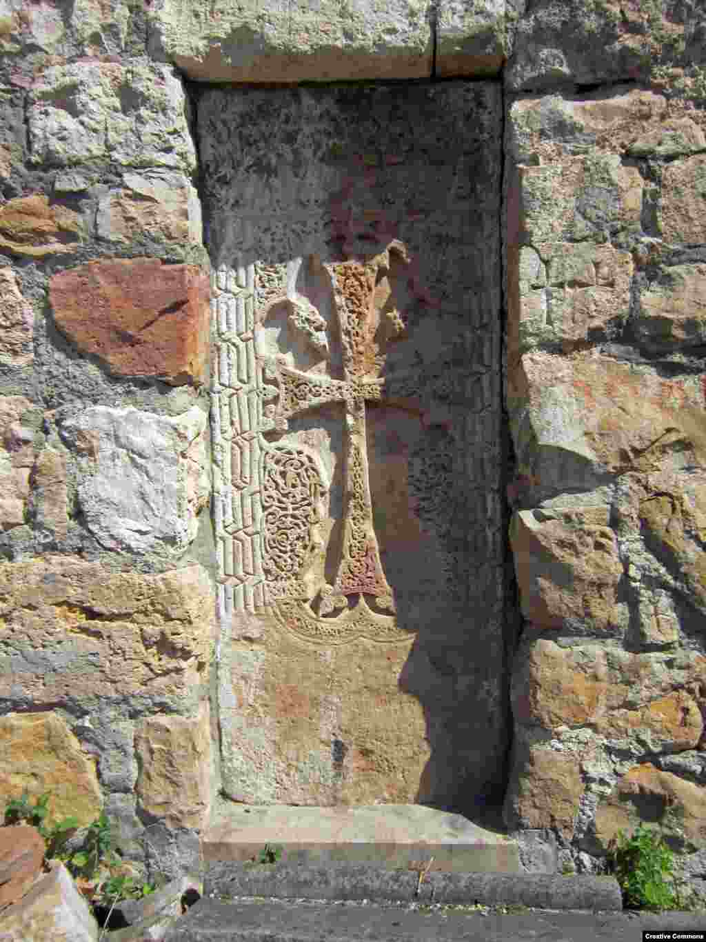 A detail of a carved stone cross (visible just right of center in the previous photo) near the entrance to Gtichavank. The monastery was completed in 1248. 