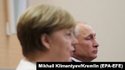 Канцлер Германии Ангела Меркель и президент России Владимир Путин. Сочи, 18 мая 2018 года.