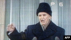 Romanian President Nicolae Ceausescu delivers his last public speech from the balcony of the Communist Party headquarters in Bucharest on December 21, 1989.