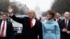 U.S. President Donald Trump and first lady Melania Trump walk during the inaugural parade from the U.S. Capitol in Washington last month. 