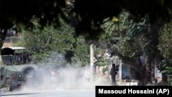 A special-forces soldier fires his weapon during a clash between insurgents and security forces in Kabul on August 16.