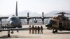 Afghan pilots stand alongside their aircraft in Kabul