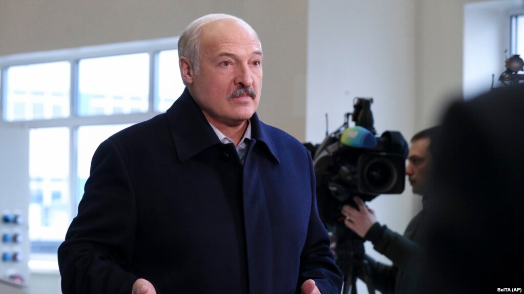 Belarusian President Alyaksandr Lukashenka speaks to journalists as he visits a paper factory in Dobrush, Belarus, on February 4.