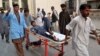 A boy who was injured in a roadside bomb blast is brought to a local hospital in Quetta, Balochistan Province on August 11. 