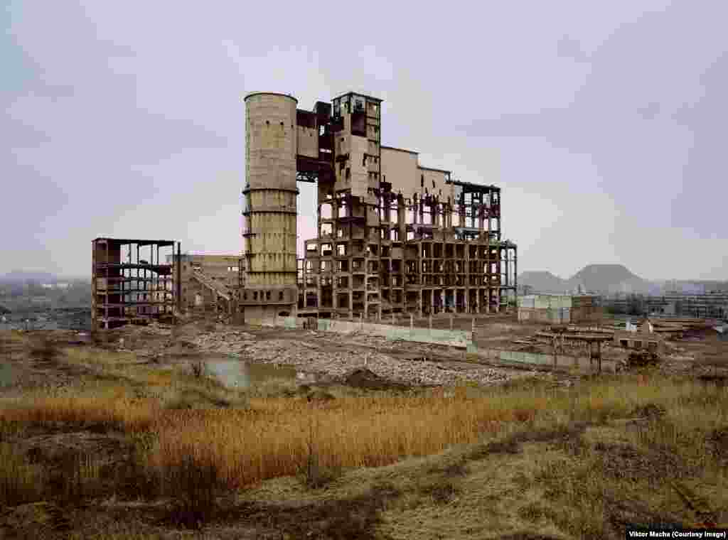 An abandoned mercury plant in Horlivka, Ukraine. The crumbling structure has since been demolished. Macha says a local man guiding him around the polluted ruins pointed to one of the ponds and said, "If you drink this water, you will be mutant," and wiggled six fingers on one hand. 