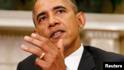 U.S. -- U.S. President Barack Obama speaks to reporters about Syria during his meeting with Indian Prime Minister Manmohan Singh in the Oval Office of the White House in Washington September 27, 2013. 