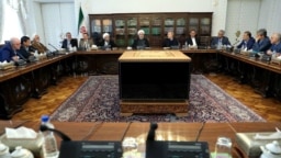 Officials at a meeting of the High Council of Coordination for Economy. President Hassan Rouhani (middle), Head of Judiciary Sadegh Larijani (left) and Speaker of Parliament, Ali Larijani (right) 2018.