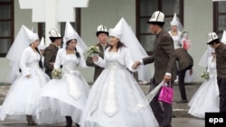 Couples take part in a mass wedding ceremony in the capital Bishkek in 2012.