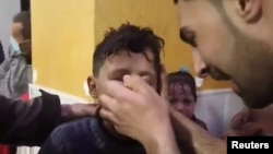 A screen grab from a video circulated by activists showing children being treated for what appears to have been a chemical gas attack in Syria. (via Reuters)