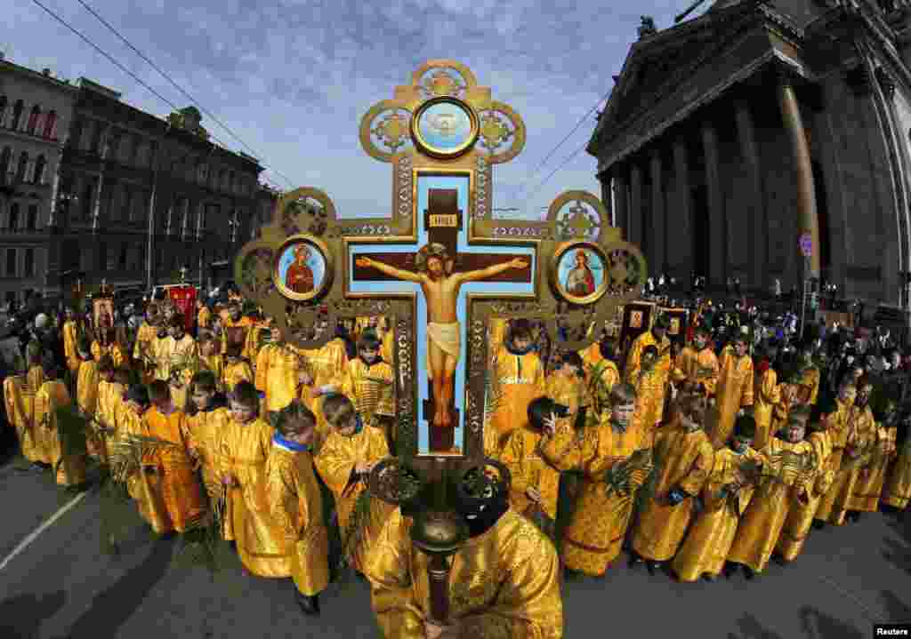 Russian children take part in a religious procession to mark Palm Sunday in St. Petersburg on April 13. (Reuters/Aleksandr Demianchuk)