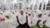 Aceh residents react during a mass prayer at the Baiturrahman mosque in Banda Aceh, Indonesia, to commemorate the victims of the Indian Ocean tsunami in 2004, which claimed the lives of more than 200,000 people. (epa/Adi Weda)