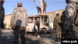 Military personnel at the scene of a suicide bombing in Kabul that killed six soldiers.
