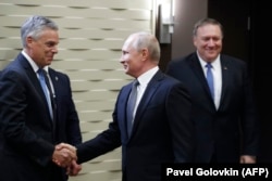 Russian President Vladimir Putin greets Huntsman during a meeting with U.S. Secretary of State Mike Pompeo (right) at the Bocharov Ruchei residence in Sochi on May 14.