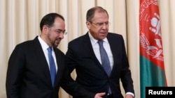 Russian Foreign Minister Sergei Lavrov and his Afghan counterpart Salahuddin Rabbani (left)