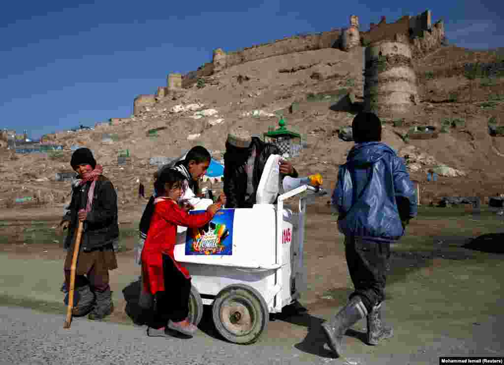 Afghan children buy ice cream in Kabul. (Reuters/Mohammad Ismail)