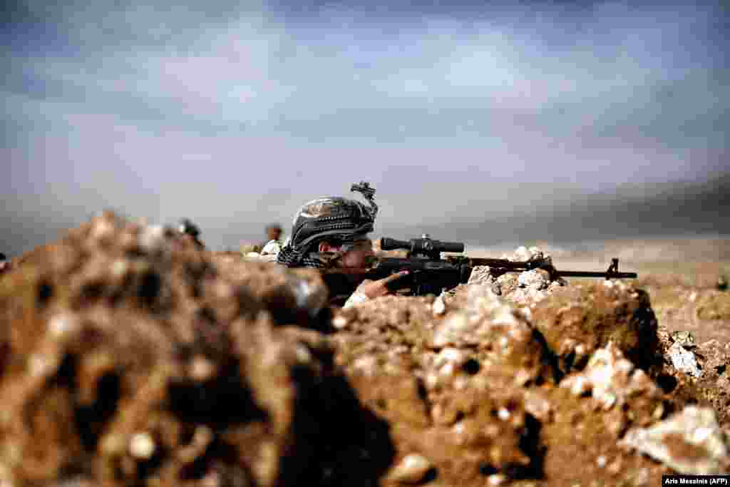 Iraqi Army troops on the outskirts of Mosul on February 27.