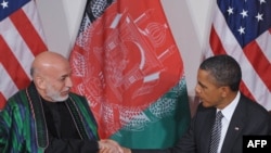 U.S. -- US President Barack Obama shakes hands with Afghanistan's President Hamid Karzai during a bilateral meeting at the Waldorf Astoria Hotel in New York City, 20Sep2011