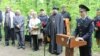 Local dignitaries and the granddaughter of NKVD officer Valter Vand attend the unveiling of a monument to victims of Stalin's Great Terror in Saransk. 