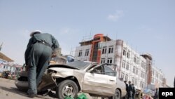 Afghan security official inspects the site of a bomb blast in northern Afghanistan. (file photo)