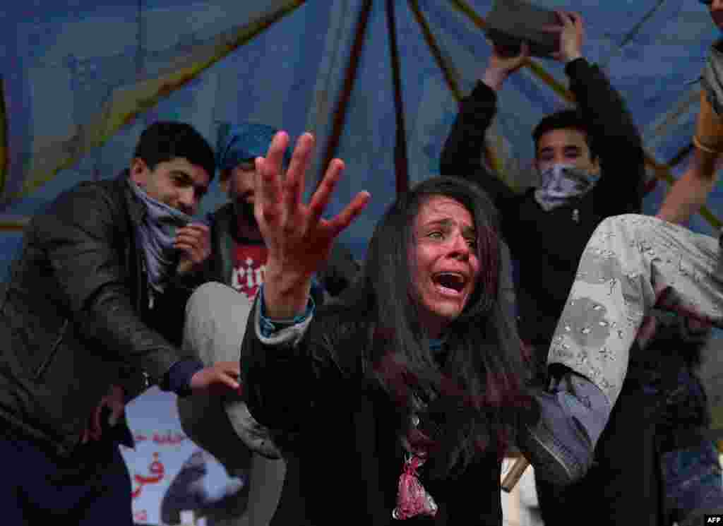 Afghan actors perform in a play depicting the 2015 lynching of Afghan woman Farkhunda Malikzada in Kabul. (AFP/Shah Marai)