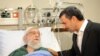 A handout photo provided by the office of Iran's supreme leader Ayatollah Ali Khamenei shows former president Mahmoud Ahmadinejad visiting him at a hospital in Tehran on September 8, 2014, after his prostate operation. 