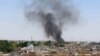 Smoke billows from the scene of a bomb explosion in Kandahar on May 22.