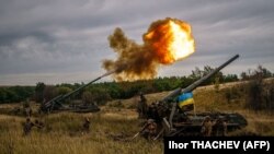 Ukrainian soldiers fire 2S7 Pion self-propelled guns in Ukraine's Donetsk region on August 26.
