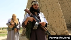 FILE: Taliban fighters in Afghanistan (June 2018).