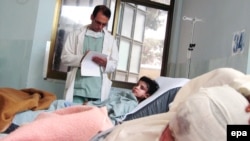 Children injured in suspected U.S.-led air strikes receive medical treatment at a local hospital in Farah Province on May 9.