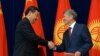 Kyrgyz President President Almazbek Atambaev (right) and his Chinese counterpart, Xi Jinping, in Bishkek on September 11