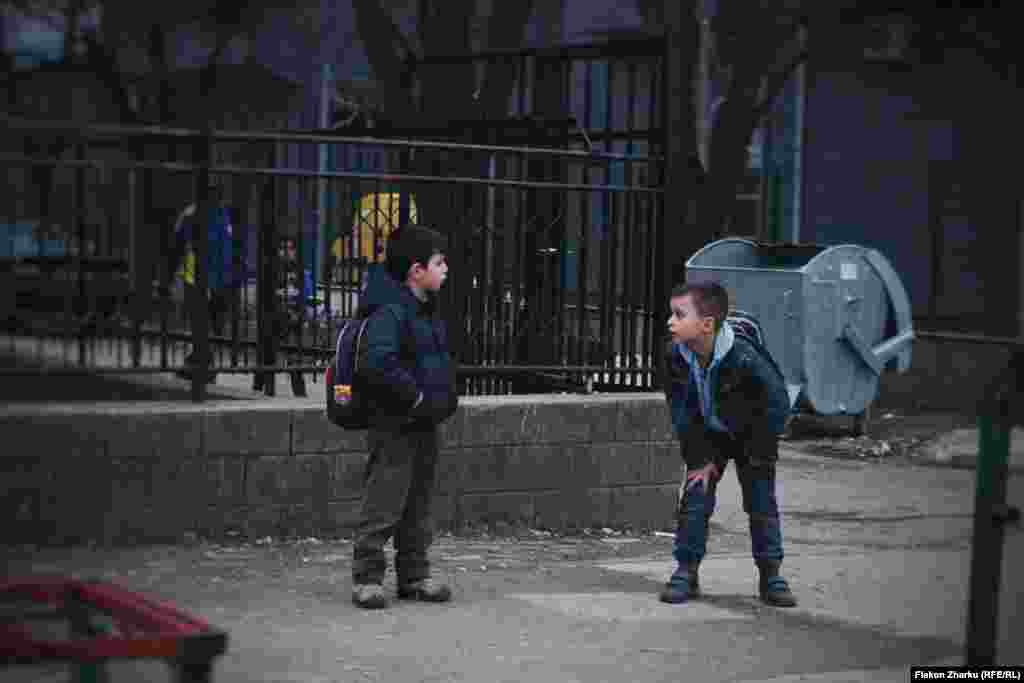 Schoolkids on the street in Fushe-Kosove, photographed by Flakon Zharku. The 17-year-old says he studied the requirements of the photo project carefully and decided to photograph the neighborhood around his house. &nbsp;