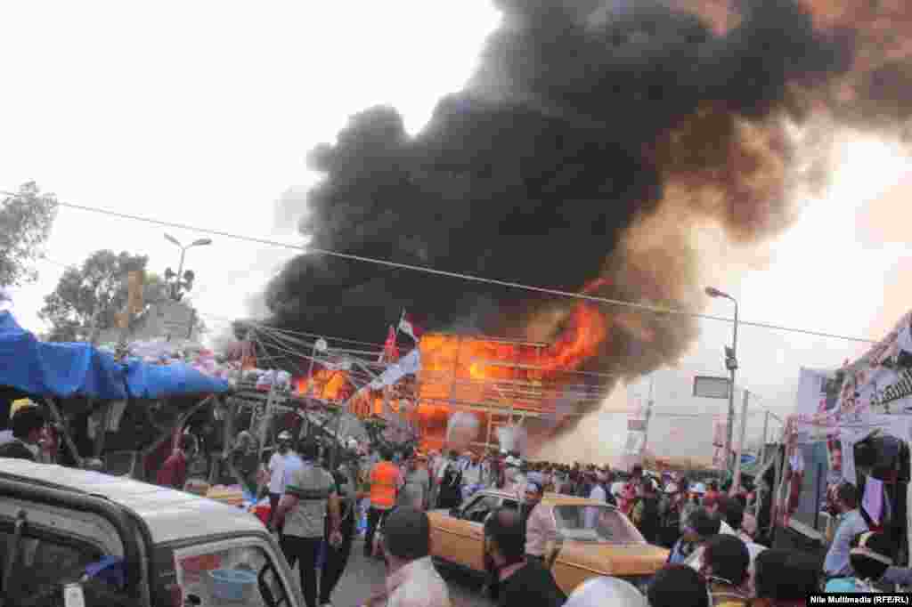 A stage burns at the sit-in camp near the Rabia al-Adawiya Mosque.