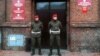 Poland -- Military police stand guard outside the military prosecutor's office in Poznan, 09Jan2012
