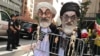 People dressed as Iran's Supreme Leader, Ayatollah Ali Khamenei and Iranian President Hassan Rohani protest on the street against Iran in New York, New York, September 24, 2018