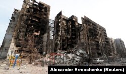 Уничтоженный жилой дом в Мариуполе во время масштабного вторжения России в Украину. Мариуполь, 30 марта 2022 года