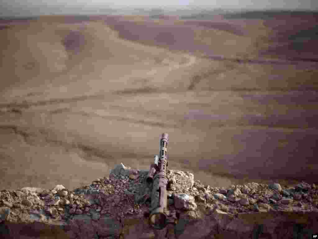 A remnant of a former Soviet fighting position against the Afghan mujahedin is marked by the rusted barrel of an old machine gun in northern Kajaki, Helmand Province, in Afghanistan. Photo by David Goldman for AP