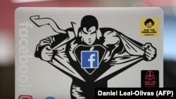 A Facebook sticker is pictured on a laptop at Facebook's