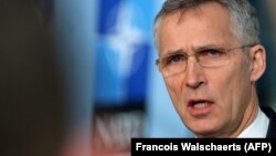 NATO Secretary-General Jens Stoltenberg addresses the media before a meeting at NATO headquarters in Brussels on February 13.