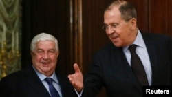 وزیران خارجه روسیه و سوریه؛سرگئی لاوروف (راست) در کنار ولید معلم 