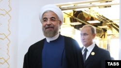 Президент Ирана Хасан Роухани (слева) и президент России Владимир Путин на саммите глав государств – членов Шанхайской организации сотрудничества. 12 сентября 2014 года