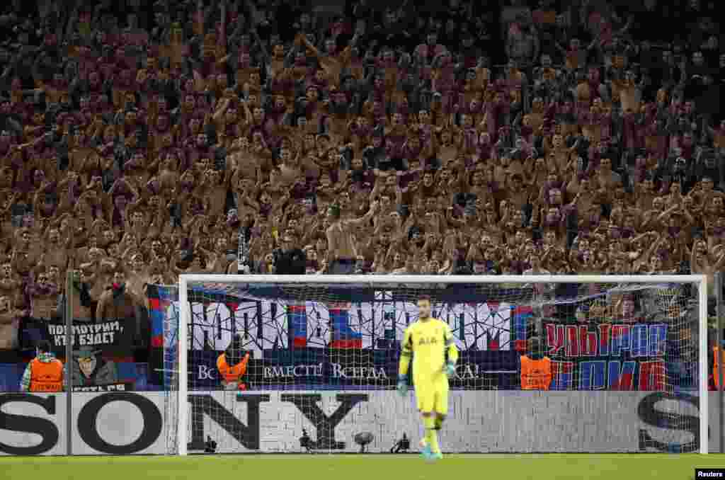 Shirtless CSKA Moscow fans, aka the Red-Blue Warriors, cheer on their team behind Hugo Lloris in the Tottenham goal during the Champions League Group E match at the Arena CSKA in Moscow on September 27. (Reuters/John Sibley)