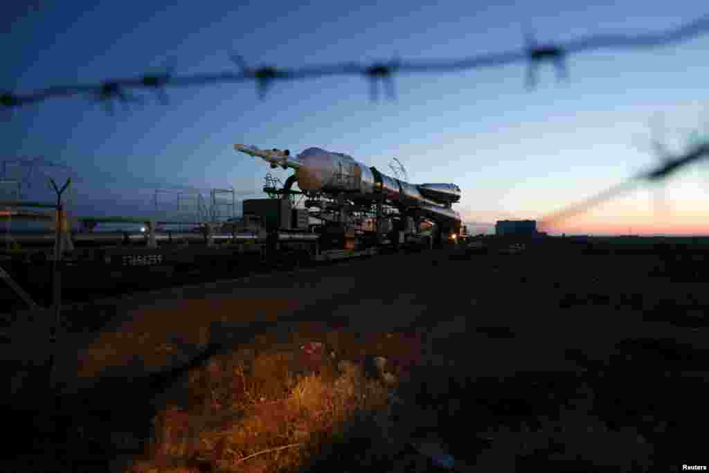 The Soyuz TMA-16M spacecraft is transported to its launch pad at the Baikonur Cosmodrome in Kazakhstan. The Soyuz is scheduled to blast off on March 28 with Russian cosmonauts Mikhail Kornienko and Gennady Padalka and NASA astronaut Scott Kelly to the International Space Station. (Reuters/Maxim Zmeyev)