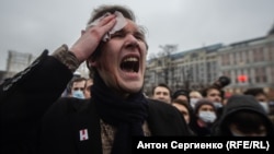 An injured protester expresses his rage at riot police in Moscow on January 23.