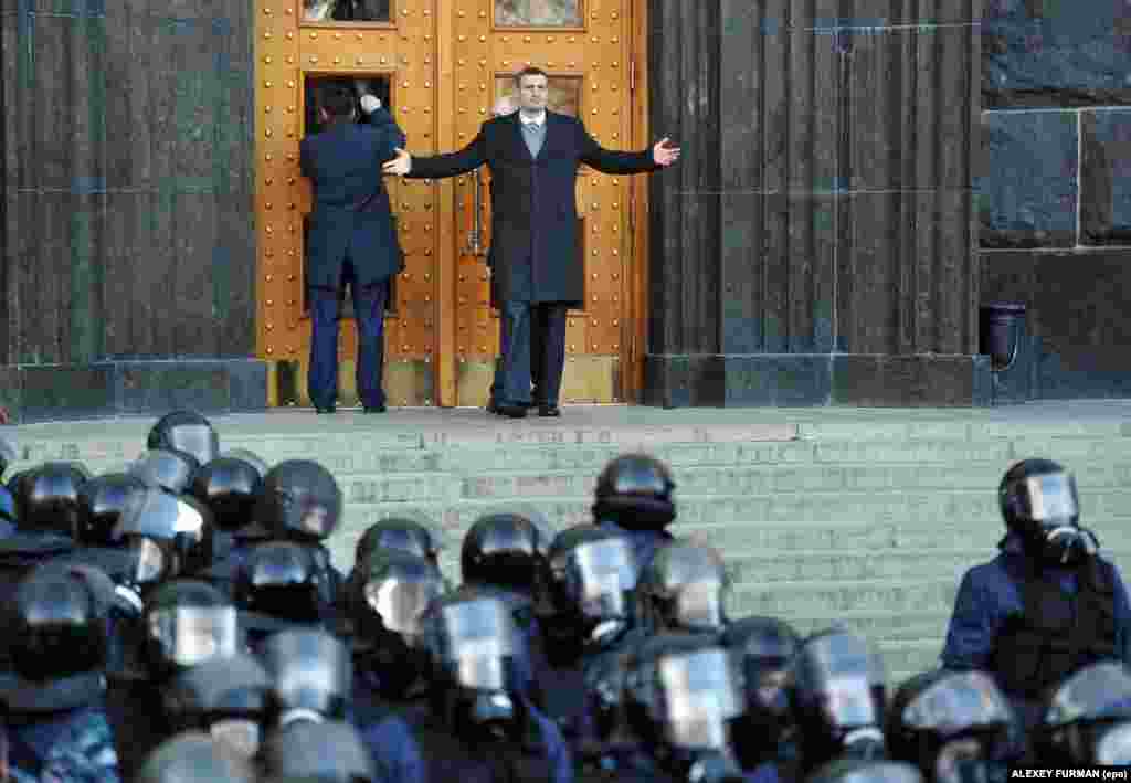 Ukrainian boxer and opposition leader Vitali Klitschko (center) gestures during a rally in front of the Cabinet of Ministers building in downtown Kyiv to protest a recent government decision to deprioritize greater integration with the European Union in favor of Russia.