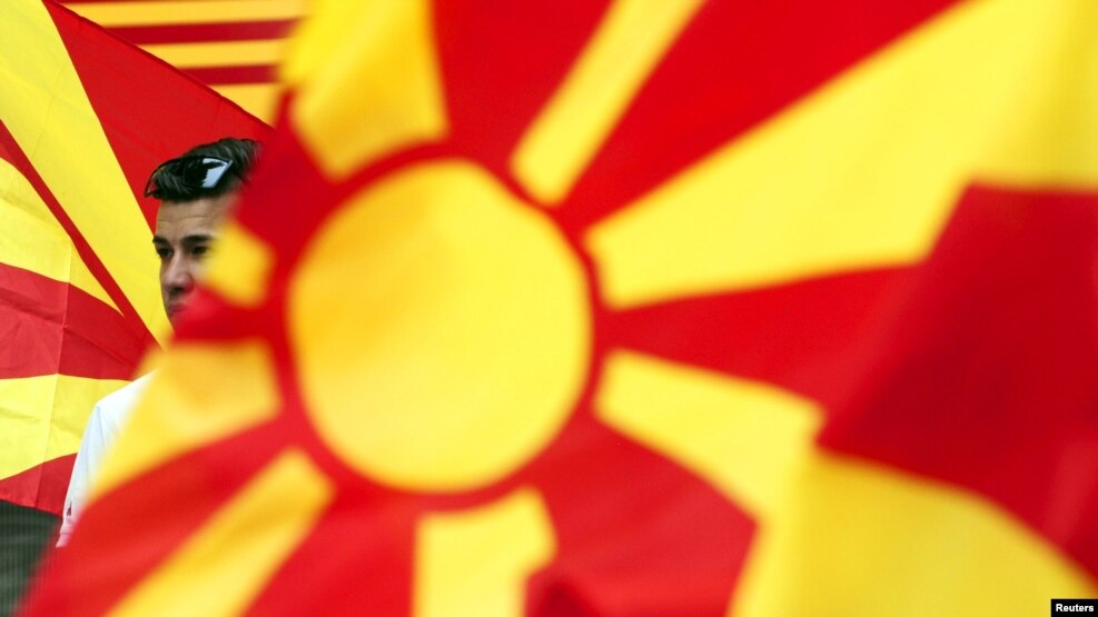 Macedonia -- A boy waves the Macedonian flag during an anti-government demonstration in Skopje, May 17, 2015. 