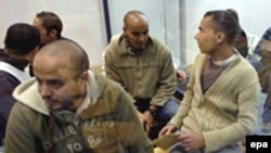Spain - Several defendants (L) chat in a glass security room at Audiencia Nacional Court's facilities, 31Oct2007